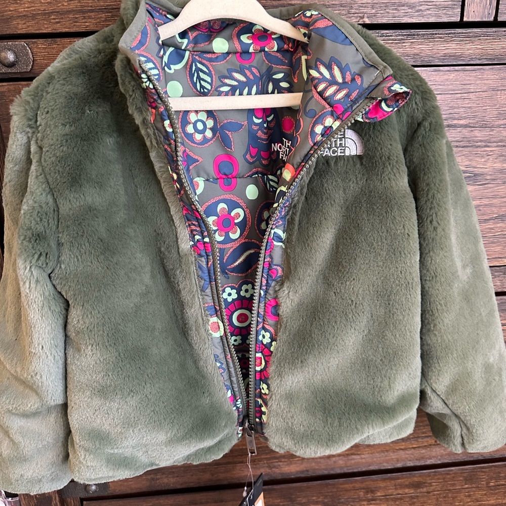 The North Face Green Puffer Jacket with Plush Texture and Cozy Design
